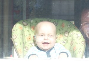 Alexander looks out the window to the world!